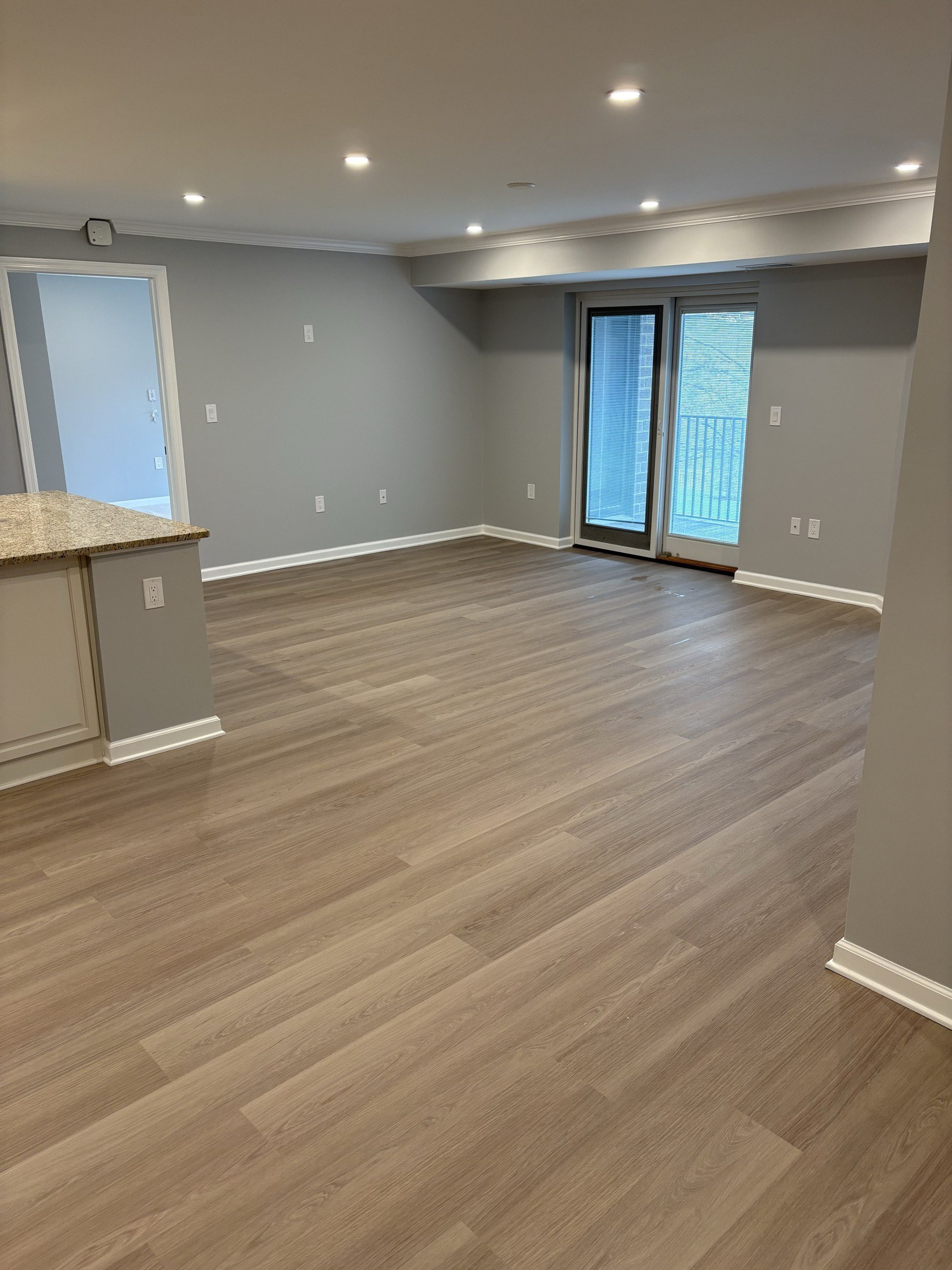 Finished basement great room with sliding glass door