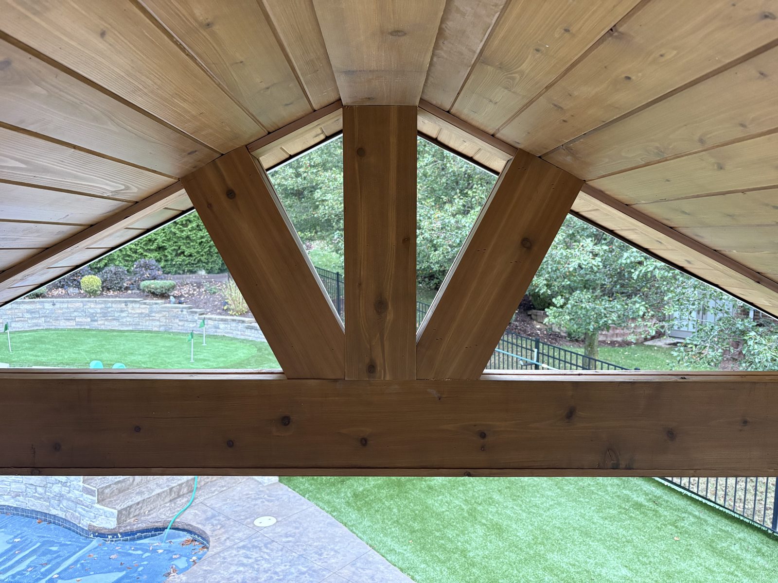 Cedar timber truss ceiling on a covered patio